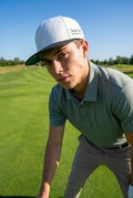 Dog Shot Golf Flat Peak Cap - Snow White with Black Peak and Green Under-bill.